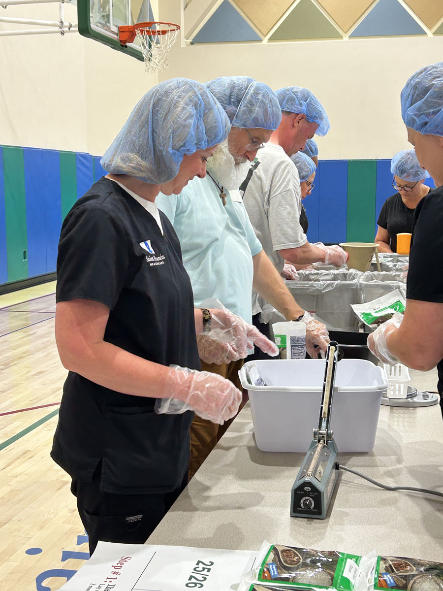 A scene from the Foundation's Saint Francis 150th Anniversary Food Packing Event