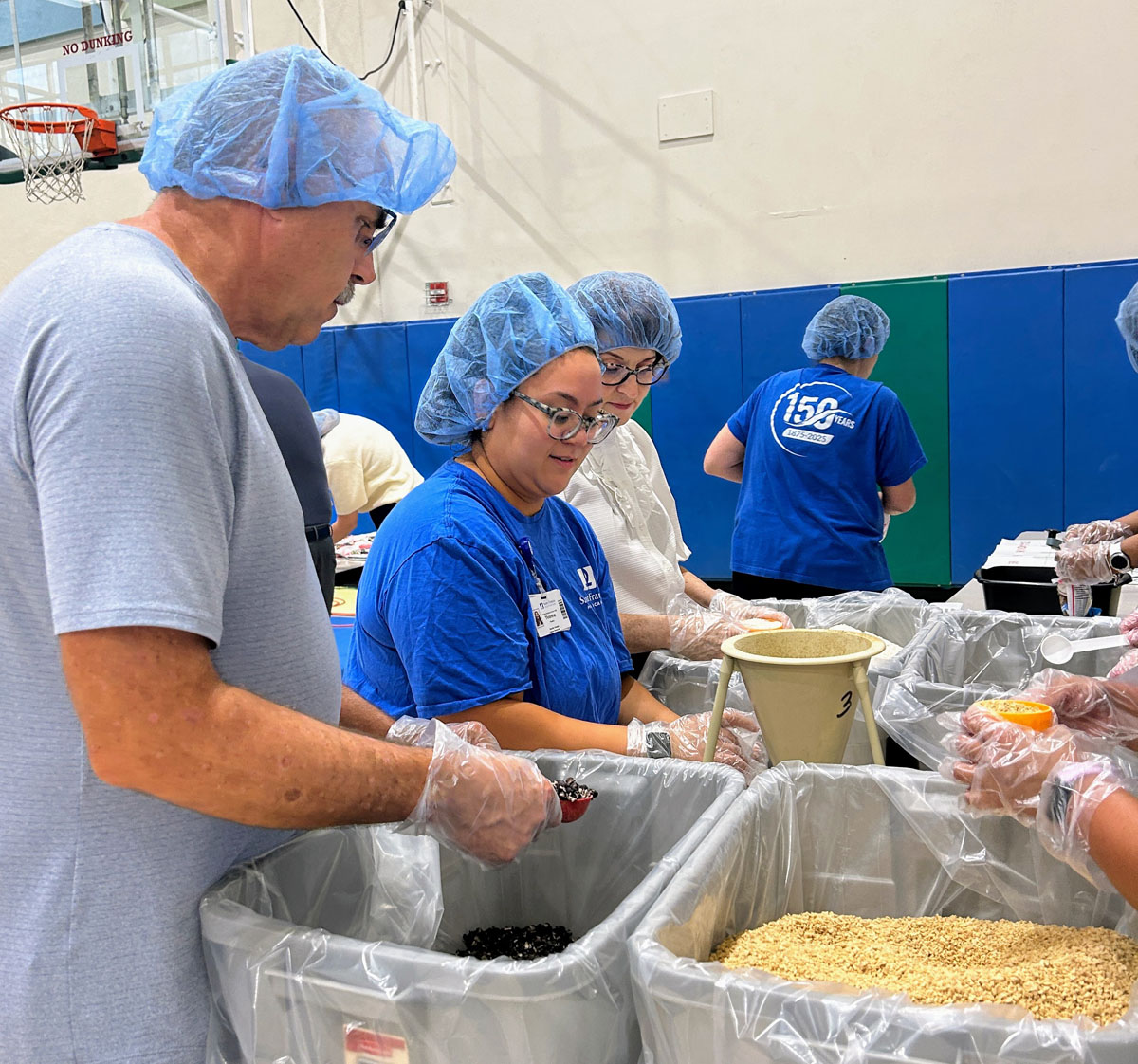A scene from the Foundation's Saint Francis 150th Anniversary Food Packing Event
