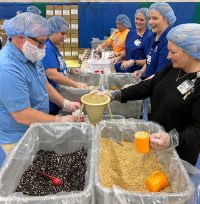 Saint Francis providers and colleagues at the Saint Francis 150th Anniversary Food Packing Event